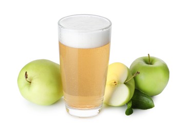 Photo of Tasty cider in glass, fresh apples and green leaves isolated on white