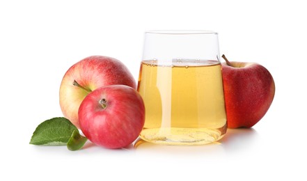 Photo of Tasty cider in glass, fresh apples and green leaves isolated on white