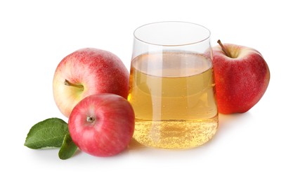 Photo of Tasty cider in glass, fresh apples and green leaves isolated on white