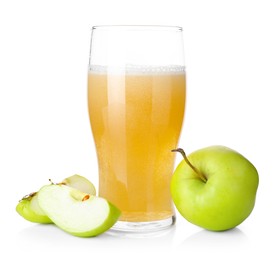 Photo of Tasty cider in glass and fresh apples isolated on white