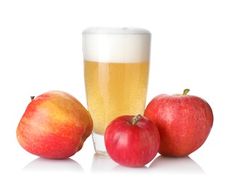 Photo of Tasty cider in glass and fresh apples isolated on white