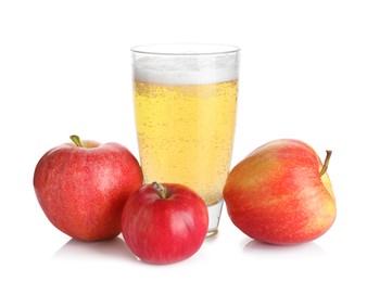 Photo of Tasty cider in glass and fresh apples isolated on white