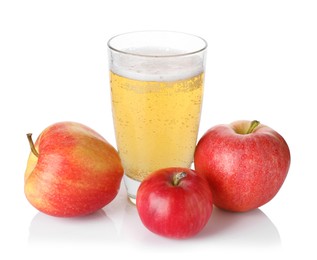 Photo of Tasty cider in glass and fresh apples isolated on white