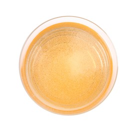Photo of Tasty cider in glass isolated on white, top view