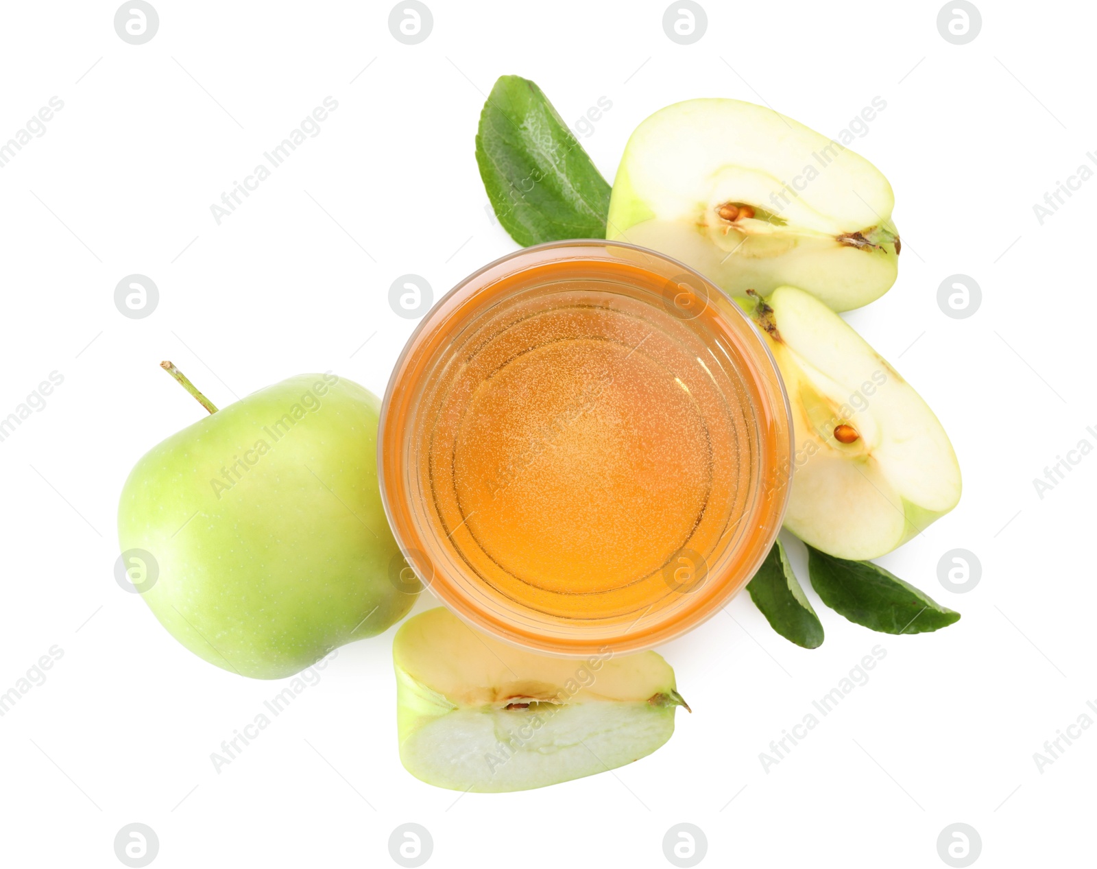 Tasty cider in glass, fresh apples and green leaves isolated on white, top view Photo of Tasty cider in glass, fresh apples and green leaves isolated on white, top view