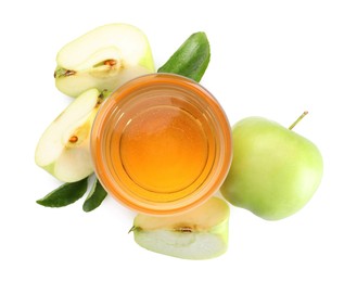 Photo of Tasty cider in glass, fresh apples and green leaves isolated on white, top view