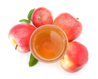 Photo of Tasty cider in glass, fresh apples and green leaves isolated on white, top view
