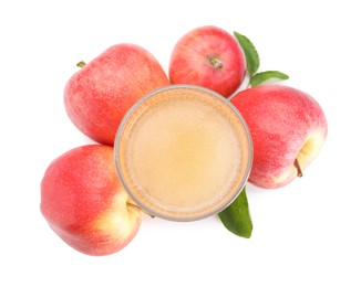 Photo of Tasty cider in glass, fresh apples and green leaves isolated on white, top view