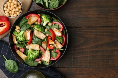 Photo of Tasty salad with eryngium mushrooms served on wooden table, flat lay. Space for text