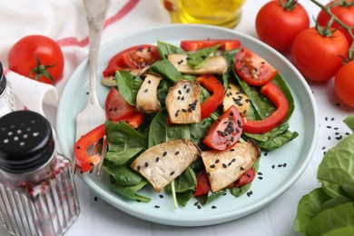 Photo of Tasty salad with eryngium mushrooms served on white table, closeup