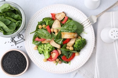 Photo of Tasty salad with eryngium mushrooms served on light table, flat lay