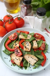 Photo of Tasty salad with eryngium mushrooms served on white table, closeup