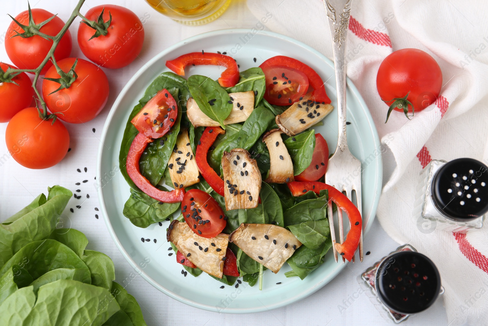Tasty salad with eryngium mushrooms served on white table, flat lay Photo of Tasty salad with eryngium mushrooms served on white table, flat lay