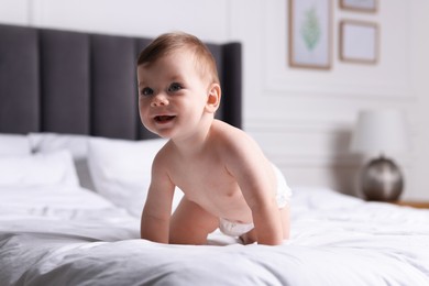 Photo of Cute little baby on bed at home