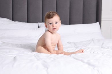 Photo of Cute little baby on bed at home