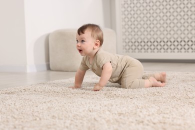 Photo of Cute little baby on floor at home, space for text