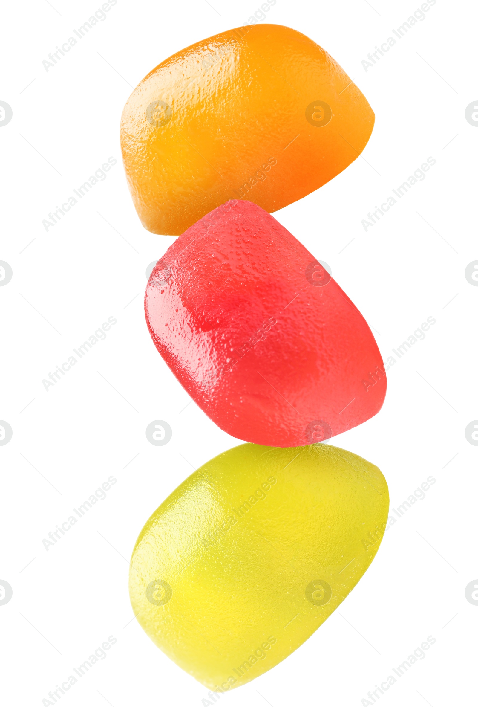 Image of Sweet jelly candies falling against white background