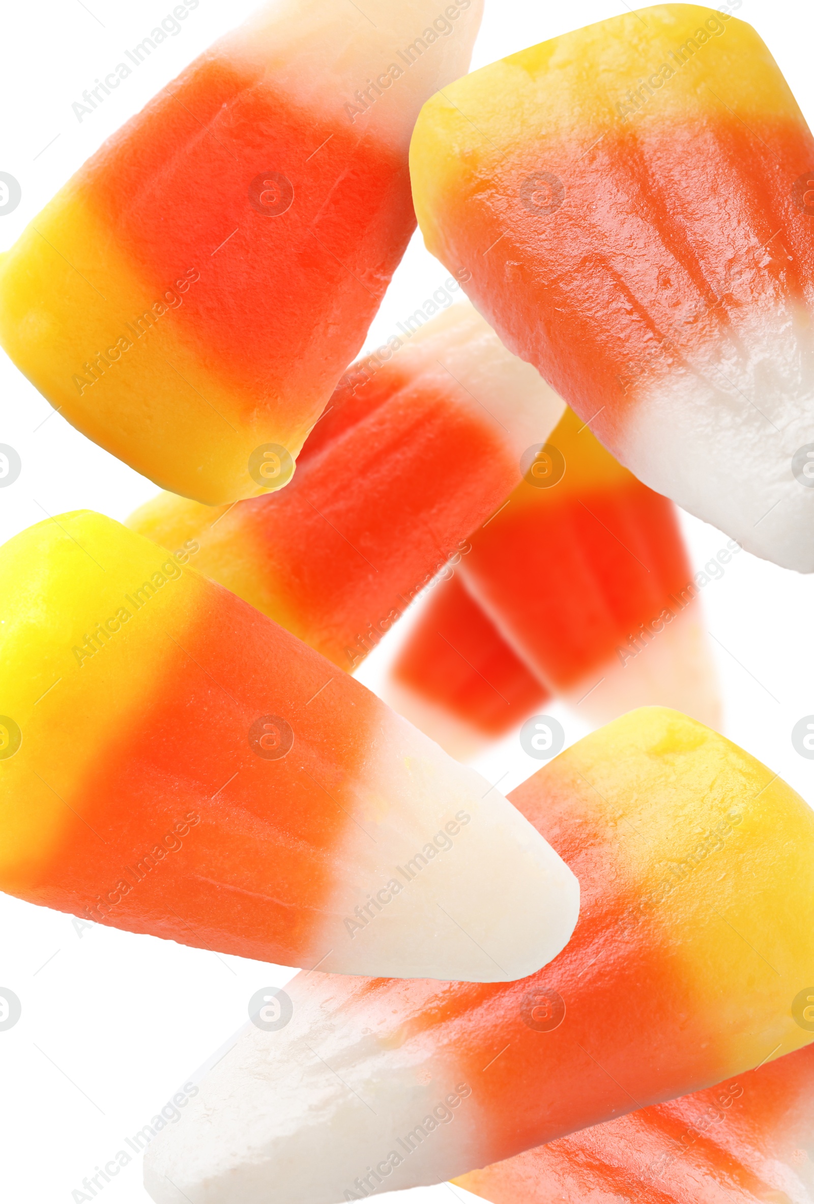 Sweet jelly candies falling against white background Image of Sweet jelly candies falling against white background