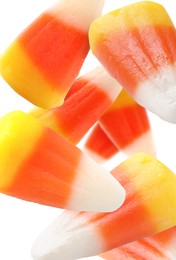 Image of Sweet jelly candies falling against white background