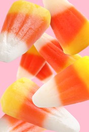 Image of Sweet jelly candies falling against pink background