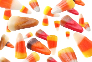 Image of Sweet jelly candies falling against white background