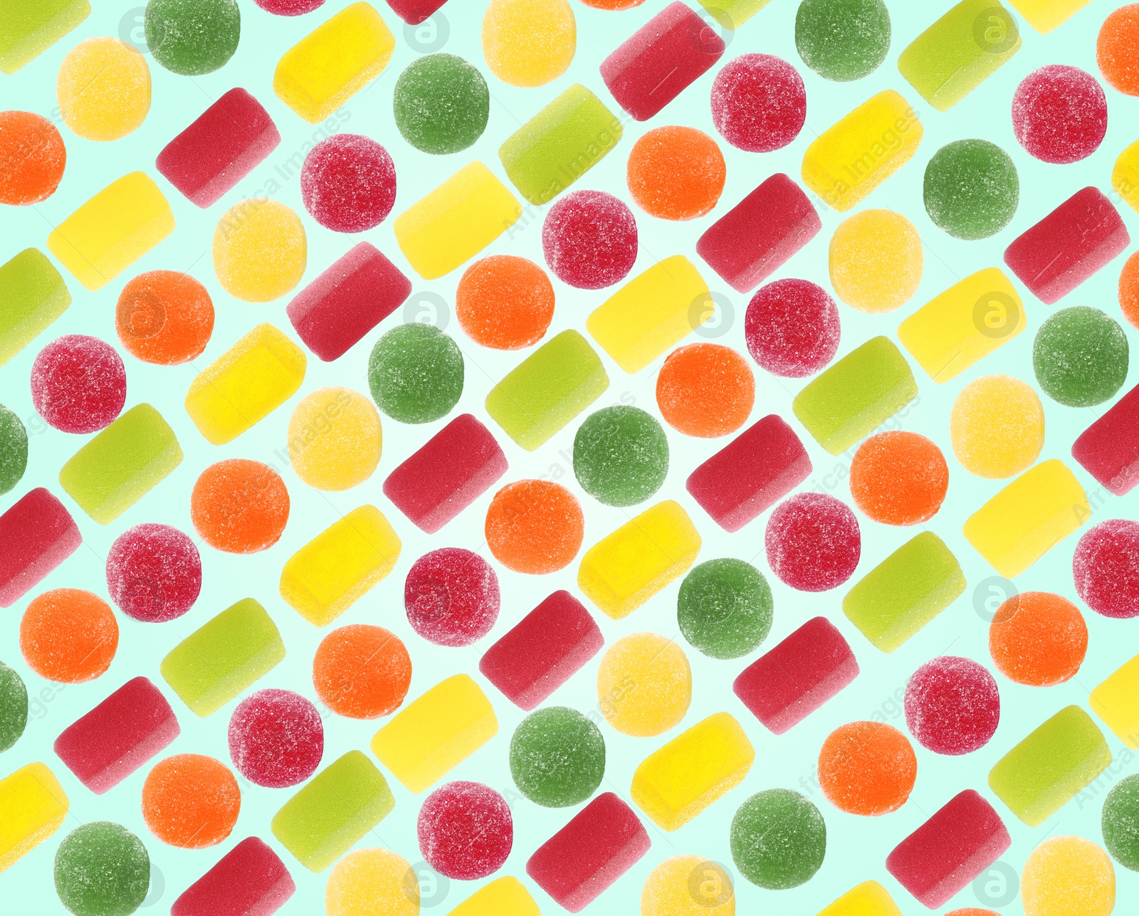 Image of Pattern of sweet jelly candies on light blue background
