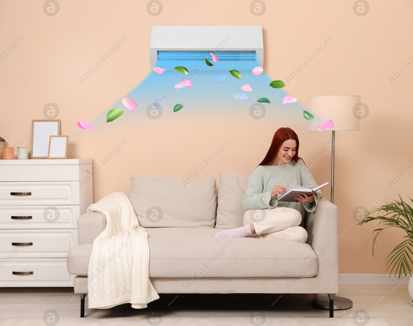 Happy woman reading book at home. Air conditioner keeping comfortable temperature in room Image of Happy woman reading book at home. Air conditioner keeping comfortable temperature in room