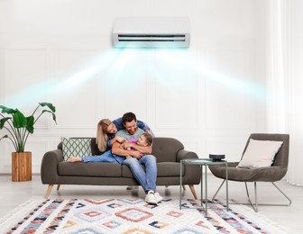 Image of Happy family having fun together at home. Air conditioner keeping comfortable temperature in room