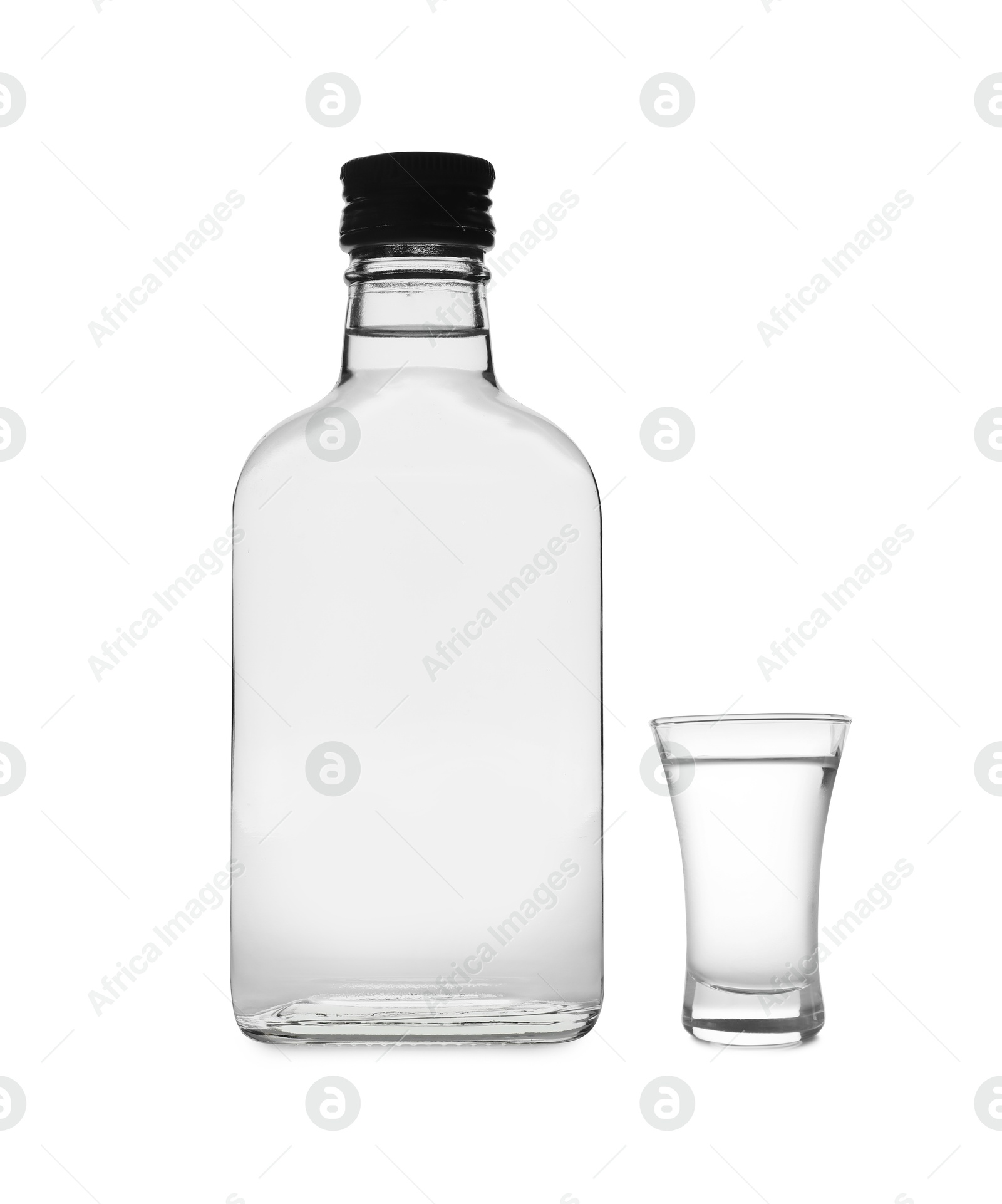 Image of Vodka in bottle and shot glass isolated on white