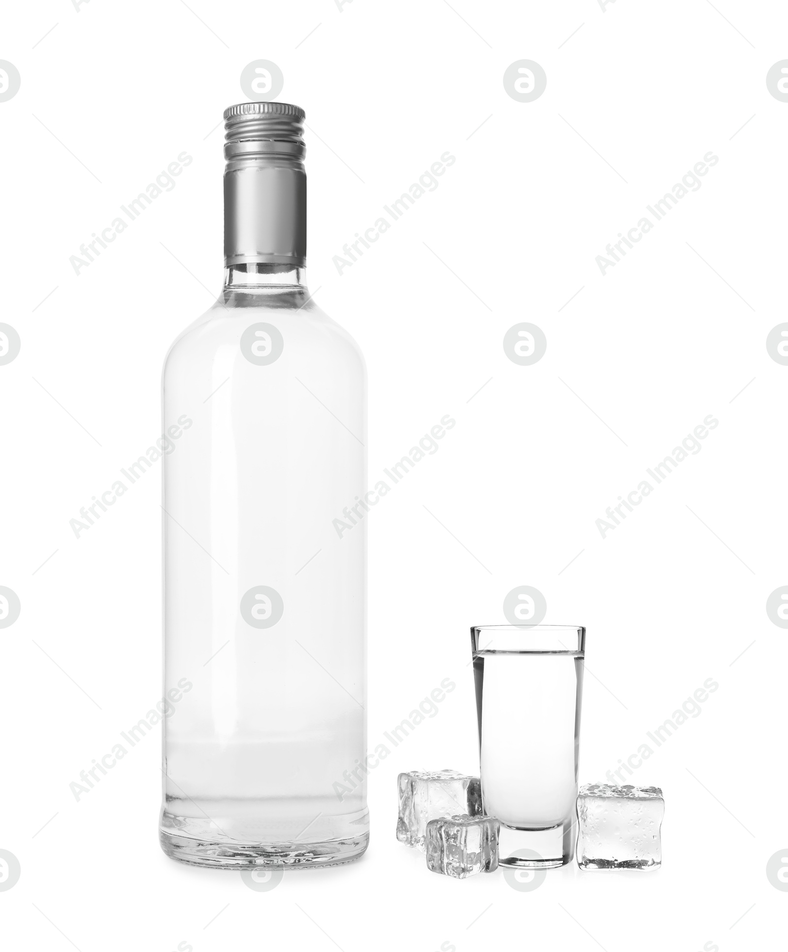 Vodka in bottle and shot glass isolated on white Image of Vodka in bottle and shot glass isolated on white