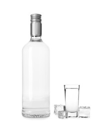 Image of Vodka in bottle and shot glass isolated on white