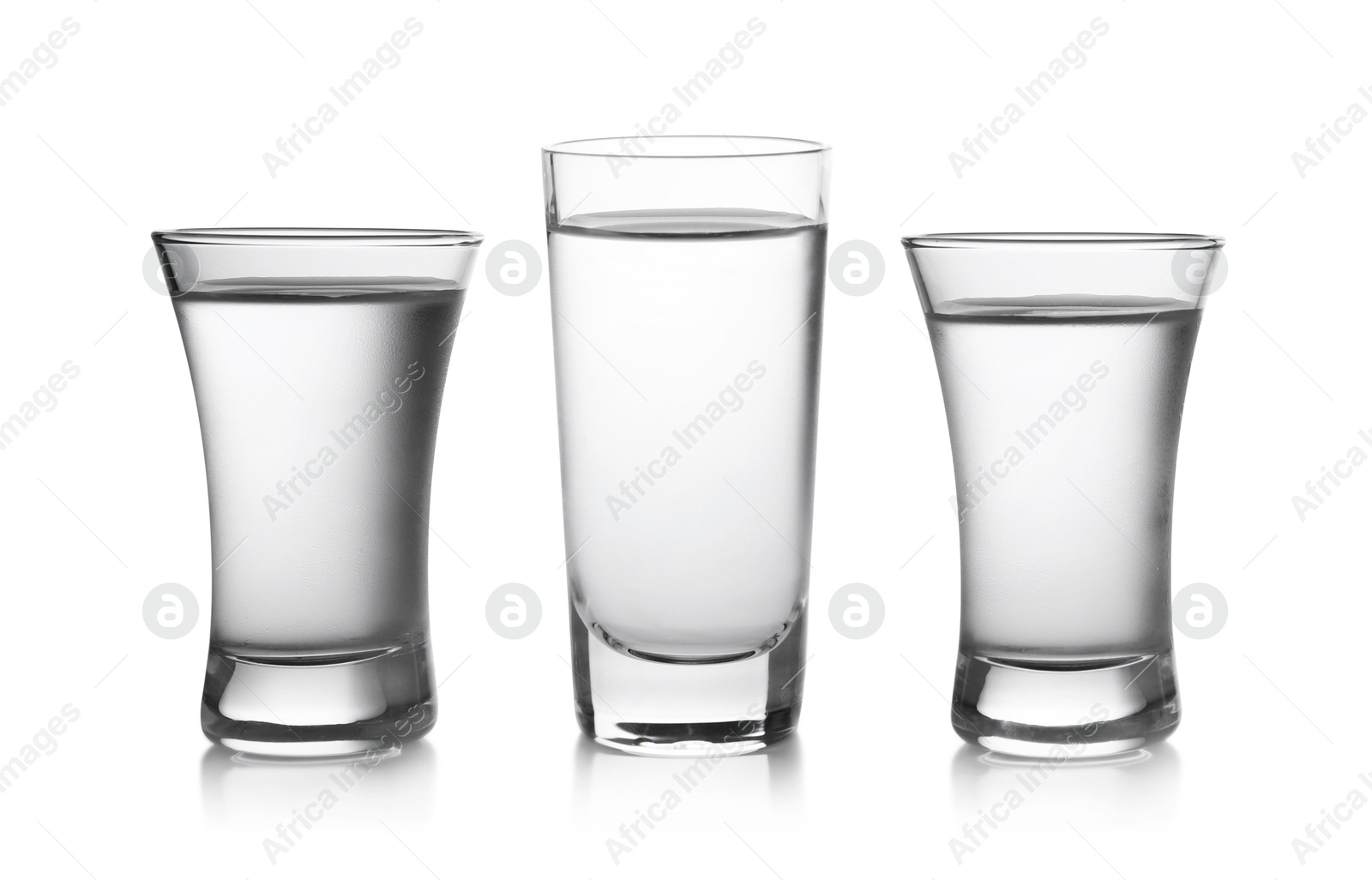 Image of Vodka in shot glasses isolated on white, set