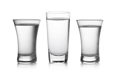 Image of Vodka in shot glasses isolated on white, set