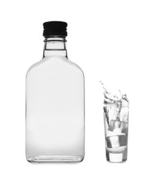 Image of Vodka in bottle and shot glass isolated on white