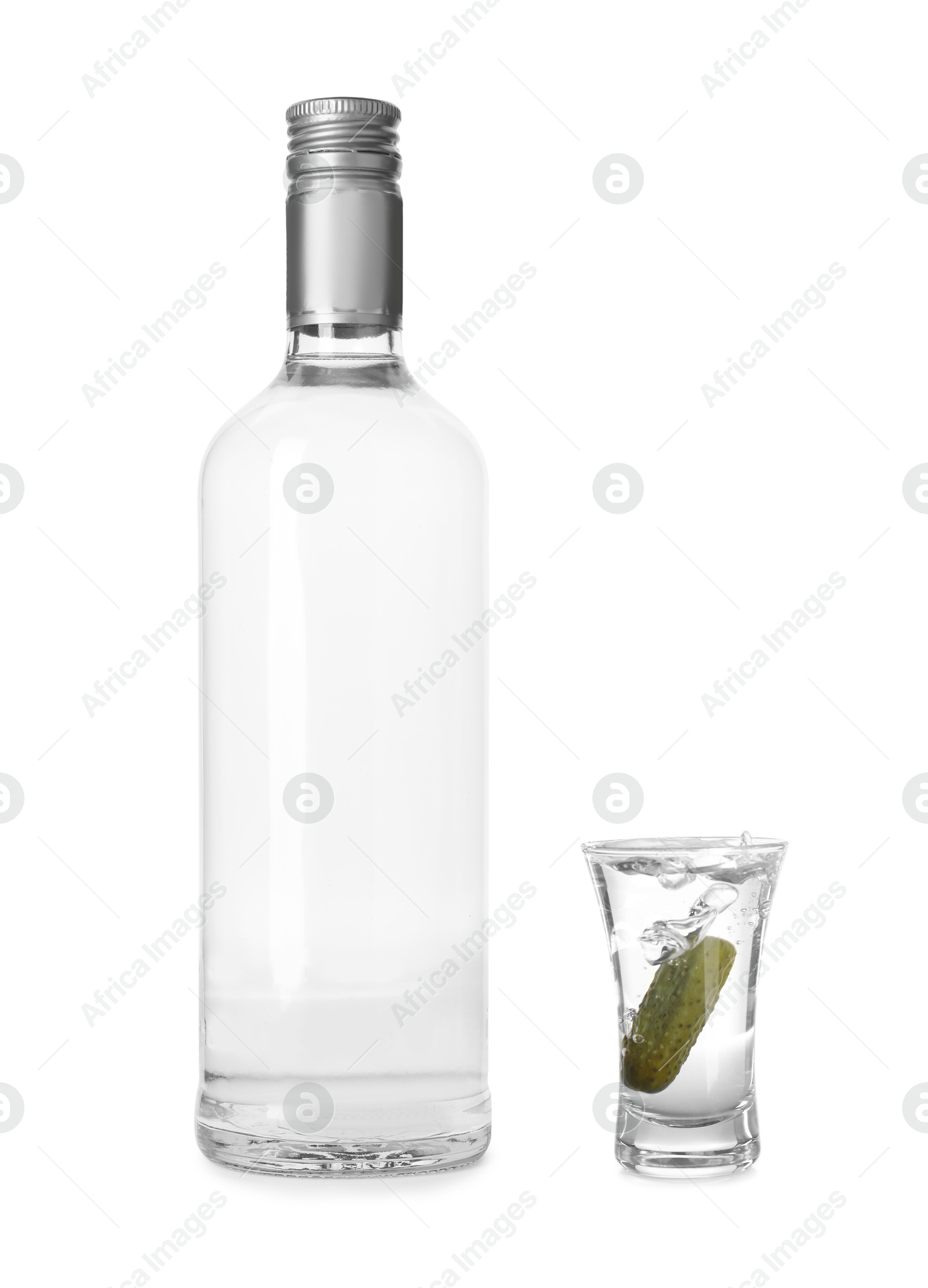 Image of Vodka in bottle and shot glass isolated on white