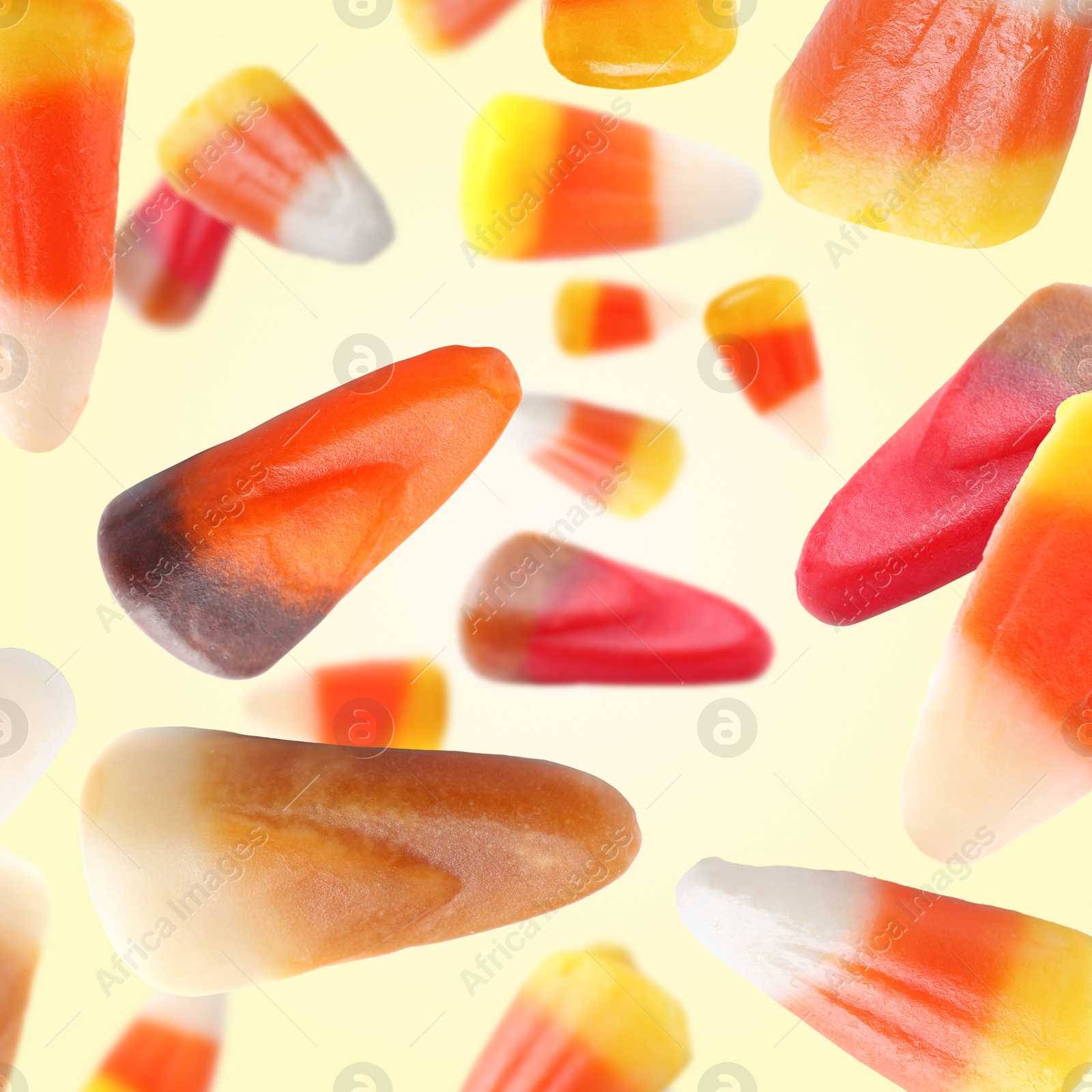 Image of Jelly candies in air against beige background