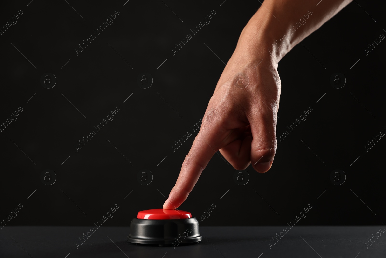 Man pressing button on black background, closeup. Space for text Photo of Man pressing button on black background, closeup. Space for text