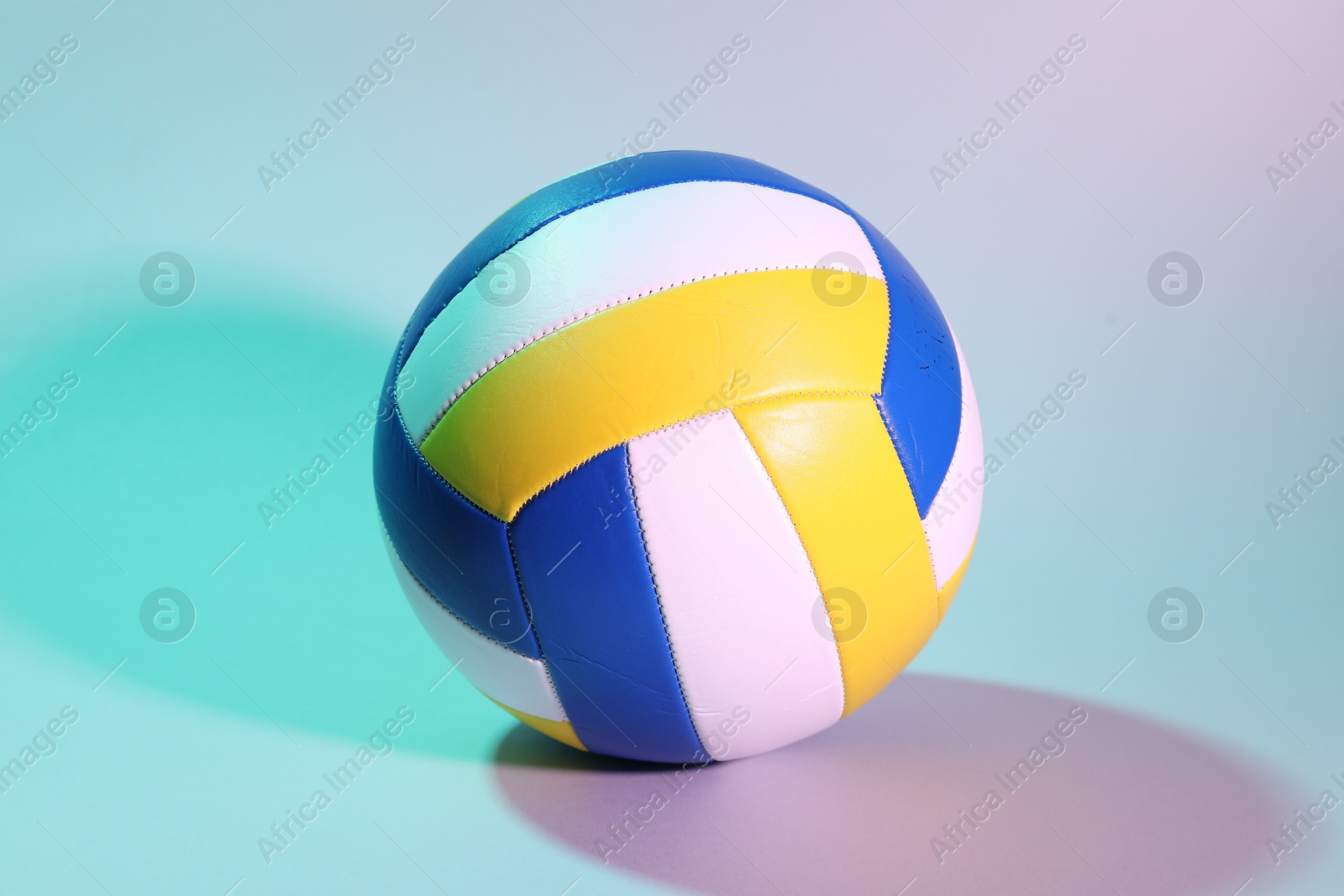 Photo of One colorful volleyball ball on light background