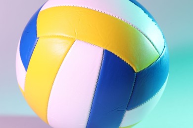 Photo of Colorful volleyball ball on light background, closeup