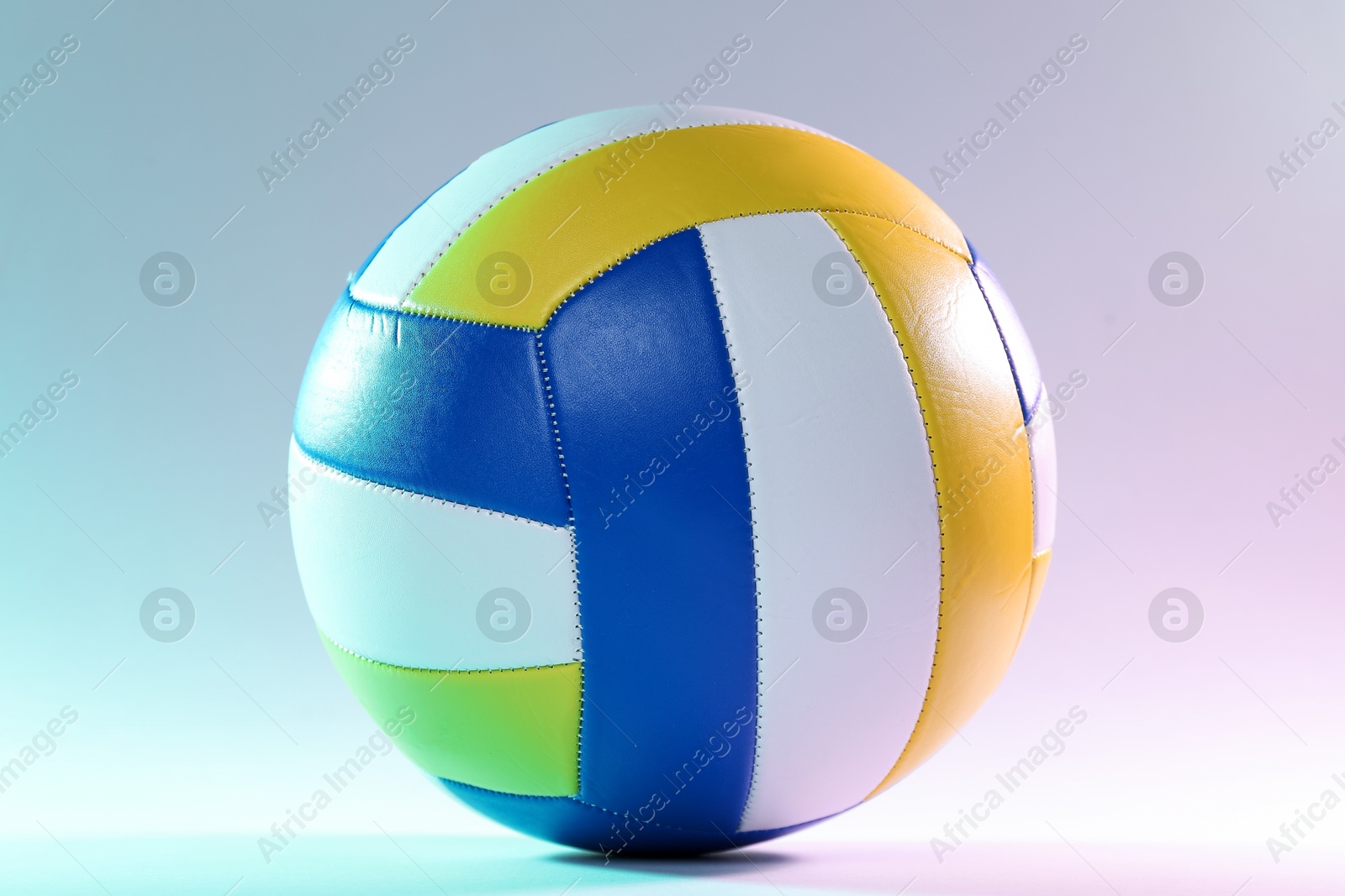 Photo of Colorful volleyball ball on light background, closeup