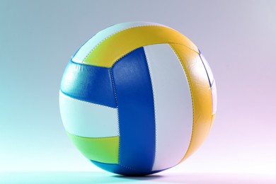 Photo of Colorful volleyball ball on light background, closeup