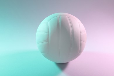 Photo of One white volleyball ball on light background