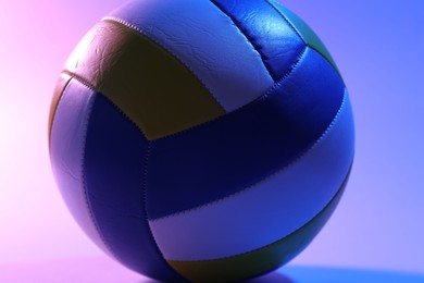 Photo of Colorful volleyball ball on color background, closeup
