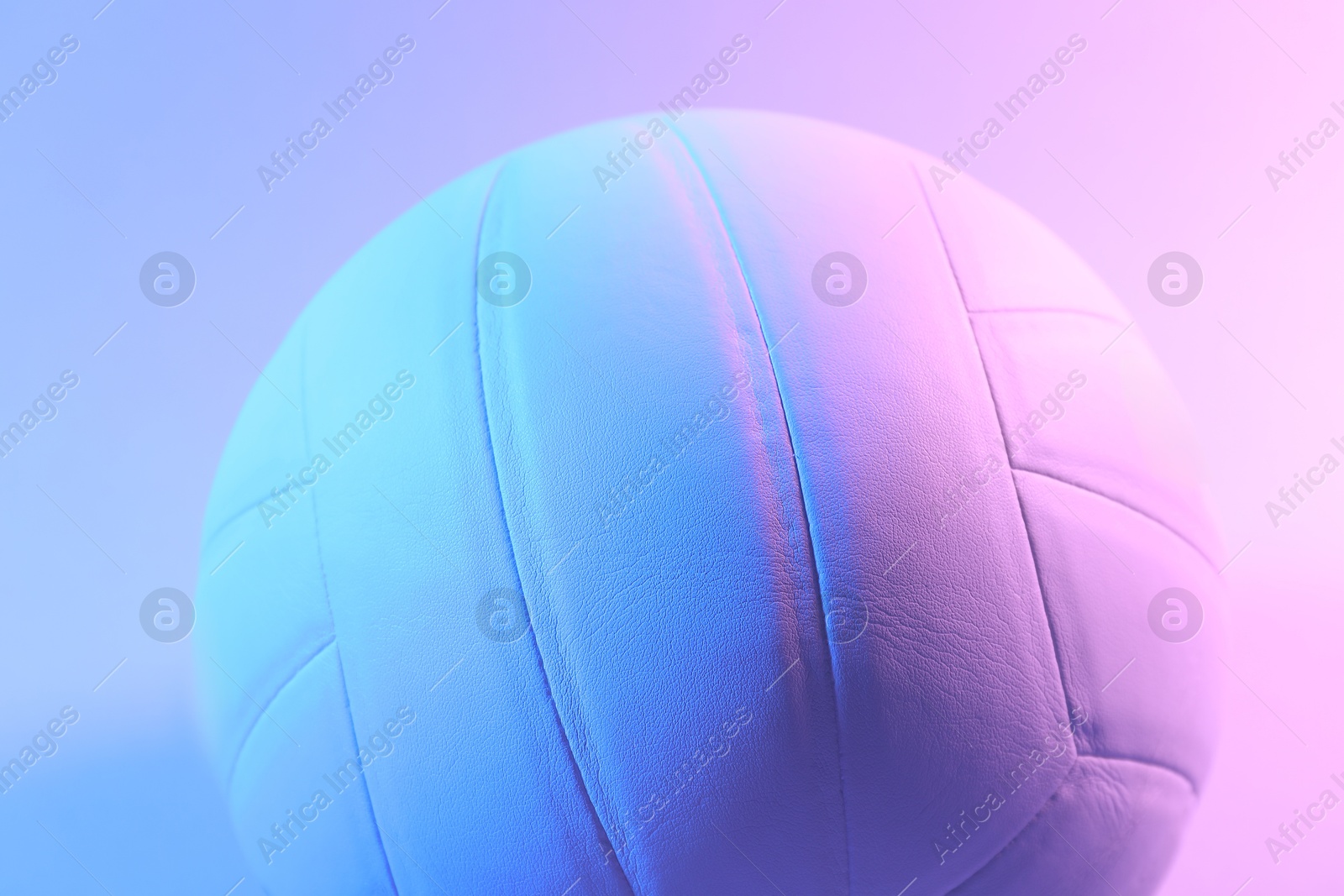 Photo of One volleyball ball on color background, closeup