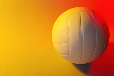Photo of Volleyball ball on color background. Space for text