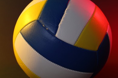 Photo of Colorful volleyball ball on color background, closeup