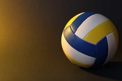 Photo of Colorful volleyball ball on color background. Space for text