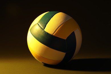 Photo of One colorful volleyball ball on dark background