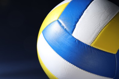 Photo of Colorful volleyball ball on dark background, closeup