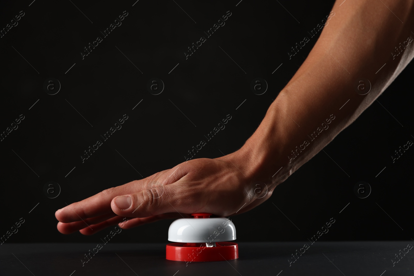 Man pressing button on black background, closeup. Space for text Photo of Man pressing button on black background, closeup. Space for text
